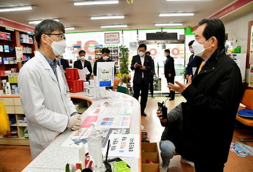 PM checks on masks at drugstore